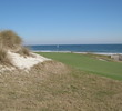 No. 5's green is only 15 feet deep by 40 feet wide, and slopes dramatically toward the sand. 