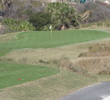 A tee shot from atop a beach dune to a bowl-shaped green awaits at the 178-yard sixth hole. 