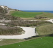 The 15th hole requires a 187-yard uphill carry to a green stacked atop a large dune. 