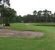 The 15th hole at Windsor Parke Golf Club squeezes a landing area between a bunker left and water right.