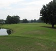 The Champions Club at Julington Creek's par-4 12th hole gives a small window for your tee shot with water left and a tree right.
