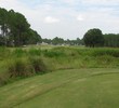 Cimarrone Golf Club's par-5 first hole includes fairway interrupted in front of the green by a mounds field.
