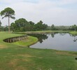There isn't a lot of real estate between the front of the green and the water at the par-3 third hole at Queen's Harbour Yacht & Country Club. 