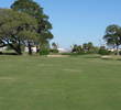 Trees and bunkers gang up on your approach shot at the par-4 13th hole at Windy Harbor Golf Club.