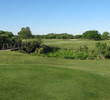 The eighth hole at Windy Harbor Golf Club is one of the best on the course. It has it all: marsh carry off the tee, bunkers and a descent to the green with water behind it.