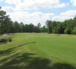 The 11th hole at The Golf Club at Fleming Island bends right with plenty of bunkers all along that side.
