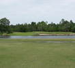 Water, then sand stand between the fairway and green on No. 4 at the Country Club of Orange Park.