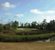 Wetlands, trees and a few forced carries from the tips characterize Queen's Harbour Yacht and C.C.