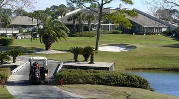 A view of the clubhouse with putting green on the right at Sawgrass Country Club